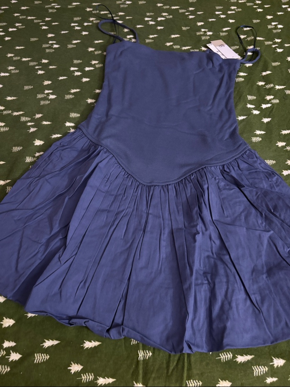 Blue Sleeveless with pleated the bottom is a balloon style.